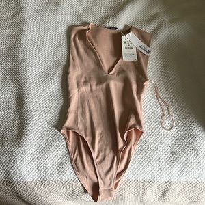 Zara bodysuit with tags still on it